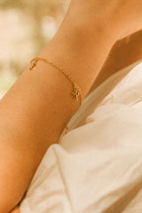 Esmeralda Gold Cross Charm Bracelet