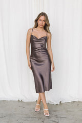 Woman wearing a brown silk slip dress